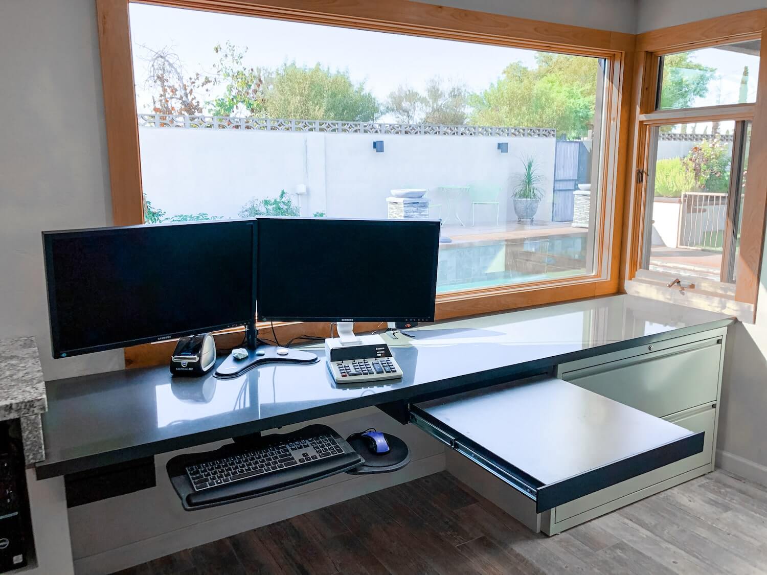 A remodeled home office in Tucson with a large window letting in natural light