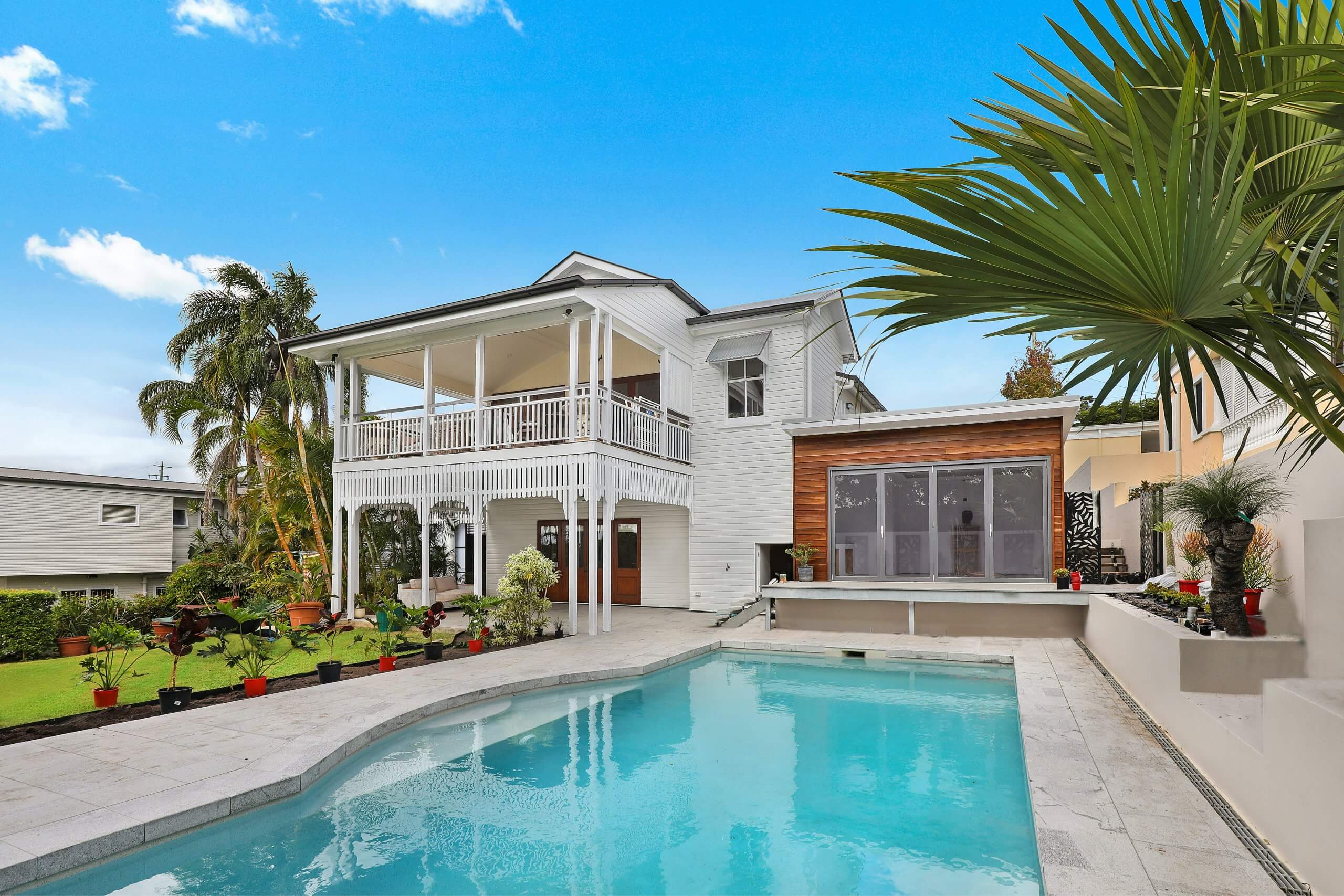 Swimming pool side of the residential home.